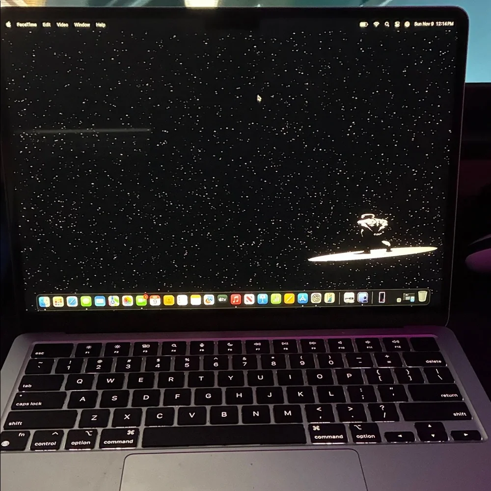 Apple MacBook with Black and Silver Design
